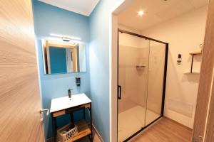 a bathroom with a sink and a shower at Mhometredici Guest House - Camere moderne a Sestu vicino aeroporto Cagliari e Policlinico in Sestu +44 photos