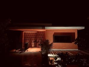 a house at night with the lights on at C South Hideout in Butong
