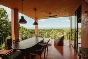 a dining room with a table and chairs at C South Hideout in Butong
