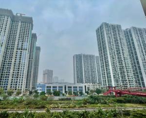 a group of tall buildings in a city at Vinsmart City Cam Cam homestay in Phú Thú