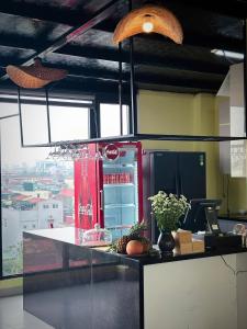 a coca cola refrigerator in a kitchen with at Hiden An Hotel in Ninh Binh