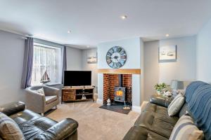 a living room with a couch and a fire place at 3 Bed in Dawlish oc-c29669 in Dawlish
