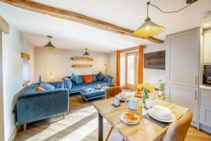 a living room with a blue couch and a table at 1 Bed in Bala oc-b27365 in Bala