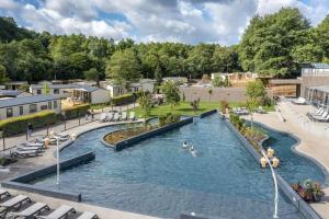 an outdoor swimming pool with people in the water at Cottage 5p 2Bdrms 16110 in Grupont