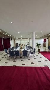 a large room with a long table and chairs at AMWAJ HOTEL in El Jadida +45 photos