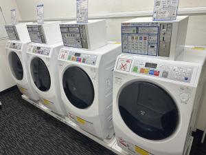 four washing machines are on display in a store at APA Hotel Gifu Hashima Ekimae in Hashima