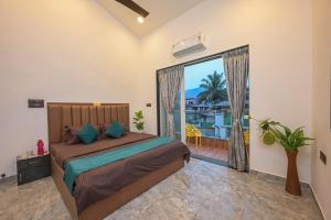 a bedroom with a bed and a large window at Vrundavan Villa Lonavala in Malavli +54 photos