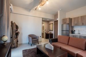 a living room with a couch and a table at LightHouse Portaria in Portaria