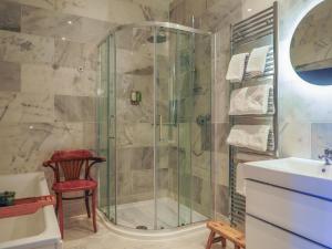 a bathroom with a shower and a sink at Sancreed House B&B in Penzance