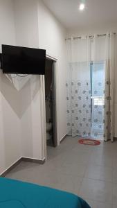 a white room with a shower and a bathroom at Ai Vecchi mulini in Gragnano