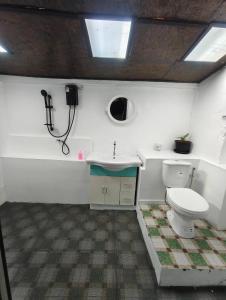 a bathroom with a toilet and a sink and a shower at The love shack atChaba in Ko Lanta +44 photos