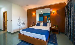 Ένα ή περισσότερα κρεβάτια σε δωμάτιο στο Motel Bracancún