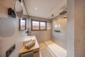 a bathroom with a sink and a shower at Ausserwieserhof in Neustift im Stubaital +56 photos