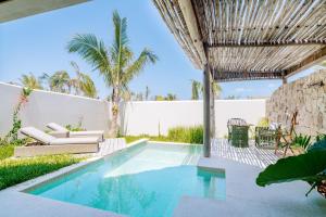 a swimming pool in the backyard of a house at Matemwe Attitude - Adults Only in Matemwe