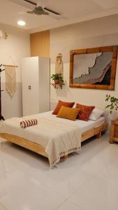 a bedroom with a large bed in a room at Newsy Inn in Hithadhoo