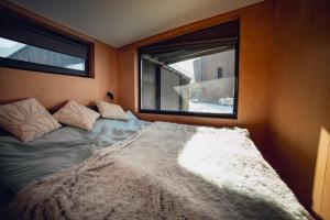 a large bed in a room with a window at La Villa Chalet and Spa in Polyana