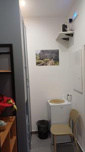 a room with a table and a chair and a picture on the wall at Ai Vecchi mulini in Gragnano
