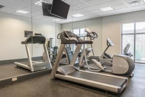 a gym with two tread machines and a treadmill at Sleep Inn & Suites Cumberland in Cumberland