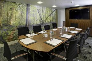 a conference room with a large table and chairs at Best Western Mornington Hotel Hyde Park in London