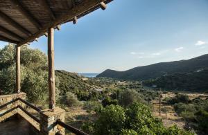 a view from the porch of a house with mountains in the background at Villa Sophia in Andros