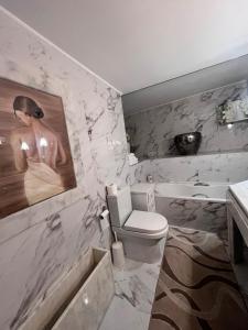 a bathroom with a toilet and a sink at Stone house Anogeia in Anogeia +33 photos