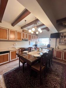 a kitchen with a dining room table and chairs at Stone house Anogeia in Anogeia