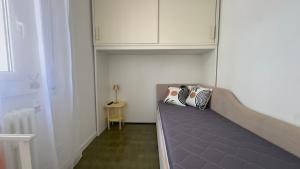 a room with a couch with two pillows on it at La Casa Di Gianni - Vista Mare in Ospedaletti