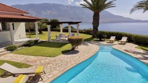 a villa with a swimming pool and a resort at Villa Ermis Spartia Kefalonia in Spartià