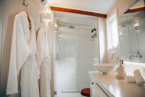 a bathroom with a shower and a sink at Breathe Glenrock Gardens in Tenterfield