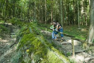 a man and woman standing on a trail in the woods at Ferienwohnung-La Casa in Heidenheim
