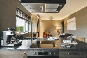 a kitchen with a sink and a coffee maker on a counter at Scar View - Getaway for Two - Ridgestone in Underbarrow
