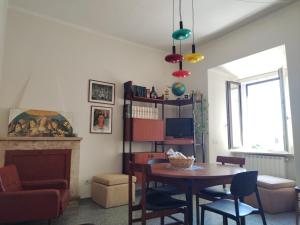 a living room with a table and a chair at Il Pettirosso alloggio turistico panoramico in Narni +13 photos