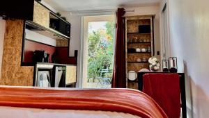 a bedroom with a bed and a room with a window at Fianca l'Osso in Belvédère