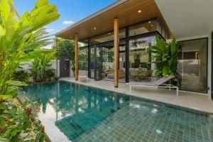 an image of a swimming pool in a house at Luxe & Privacy Orchard Villas Pasak 4BR in Laguna Phuket