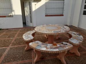 a table with mosaics on it in a room at Alojamiento BRAGADO in Bragado