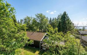 an overhead view of a house with trees at 2 Bedroom Beautiful Home In Orø in Orø +7 photos