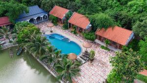 an aerial view of a house with a swimming pool at Chinh Thu Garden Homestay in Ninh Binh