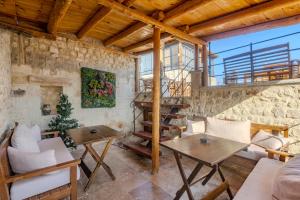 a living room with a stone wall at Zula Cave House in Ürgüp