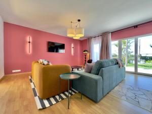 a living room with a couch and a chair at Humboldt Garden in La Orotava