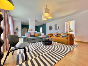 a living room with a couch and a table at Humboldt Garden in La Orotava
