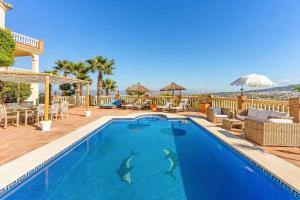 a swimming pool with a view of the ocean at Montaña Mimosa B&B in Alhaurín el Grande