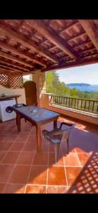 a picnic table and a bench on a patio at Residence Il Casale in Palinuro +54 photos