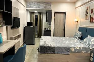 a hotel room with a bed and a television at Nova Nest in Jaipur