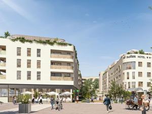 a group of people walking in front of a building at All Suites Hôtel Chartres Centre Gare in Chartres