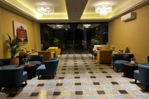 a waiting room with chairs and tables at Nova Nest in Jaipur
