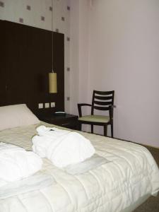 Llit o llits en una habitació de Hotel Assembly