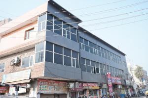 a tall building on a city street at Hotel the Chandigarh in Chandīgarh