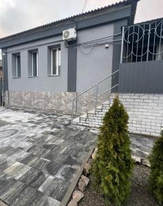 a house with a staircase in front of it at Апартаменти Карабінерная 14 in Kropyvnytskyi
