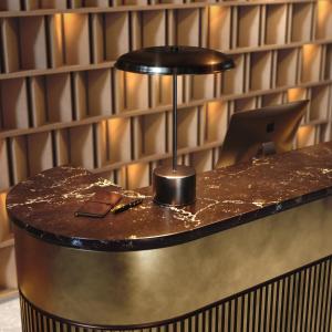 a counter in a room with a laptop on it at Intelier Malvarrosa Plaza in Valencia