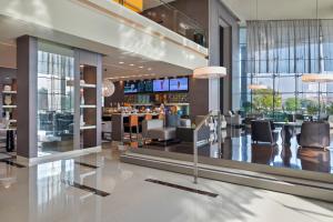 a lobby of a hotel with a bar at Park Rotana Abu Dhabi in Abu Dhabi